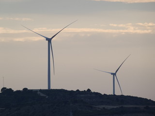 wind turbines at sunset