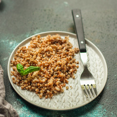 buckwheat porridge and a piece of butter (delicious food) homemade dish. food background. top