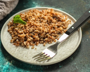 buckwheat porridge and a piece of butter (delicious food) homemade dish. food background. top