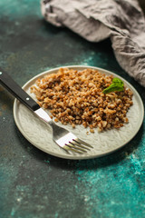 buckwheat porridge and a piece of butter (delicious food) homemade dish. food background. top