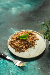 buckwheat porridge and a piece of butter (delicious food) homemade dish. food background. top