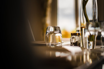 Table decorations sit on a shiny glass table.