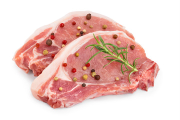 sliced raw pork meat with rosemary and peppercorn isolated on white background