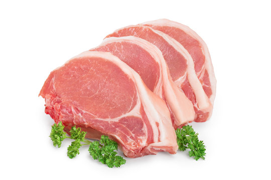 sliced raw pork meat with parsley isolated on white background