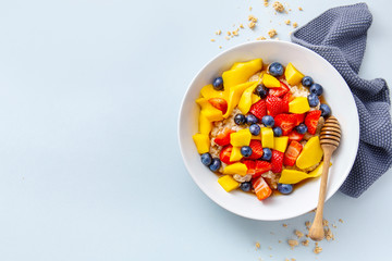 Homemade porridge served with fruits and berries
