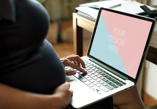 Pregnant Person Using Laptop Mockup 