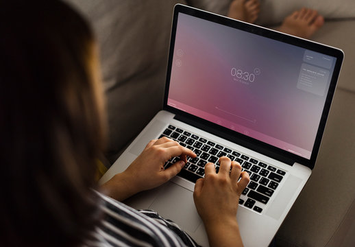 Person Using Laptop on Couch Mockup