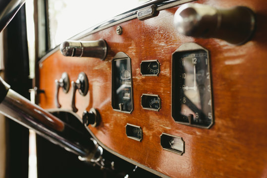 Valencia, Spain - December 8, 2018: Wooden dashboard of an old vintage car.