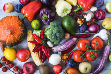 Fresh vegetables on a wooden background. Top view.