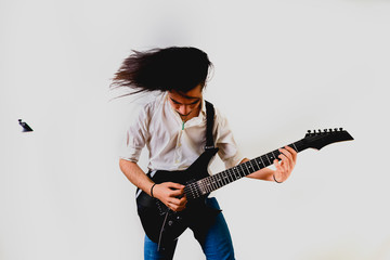 Guitarist posing with his electric guitar, white background.