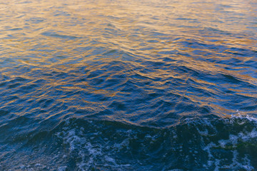 Sun reflections in water. Water ripple. close up