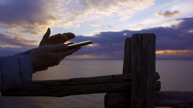 Close-up shot of a woman hands holding smartphone and scrolling the feed.