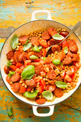 Fried chorizo sausage with chickpeas, tomatoes, lemon & basil 