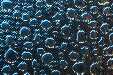 Silver Reflective Fabric Material Texture with Imitation of Water Droplets . Abstract Background of a Reflector Fabric for Lighting Equipment.