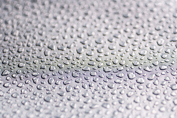 Silver Reflective Fabric Material Texture with Imitation of Water Droplets . Abstract Background of a Reflector Fabric for Lighting Equipment.