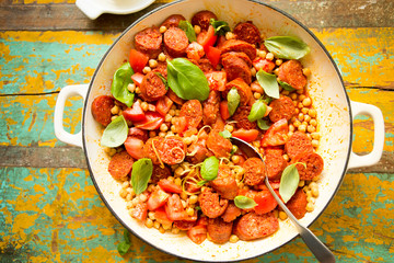 Fried chorizo sausage with chickpeas, tomatoes, lemon & basil 