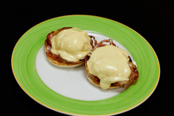 egg Benedict with poach egg, bacon and spinach