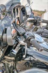 Several customized shiny black motorcycles