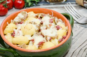 Gnocchi. Roasted gnocchi with bacon and mushrooms.     