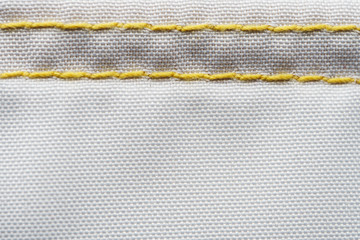 Finishing seam of a sports backpack close-up shot. Sport nylon fabric texture