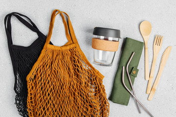 Set of Eco friendly bamboo cutlery, eco bag and reusable coffee mug. Sustainable lifestyle. Plastic...