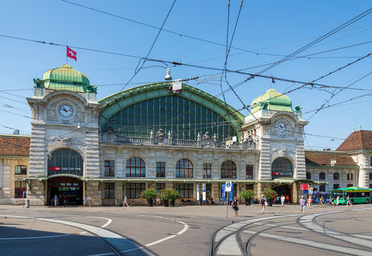Outdoor sunny view of exterior view in front of Basel Main Train Station, Bahnhof Basel SBB, with beautiful fascinated  remarkable facade of historical building in Basel, Switzerland. 