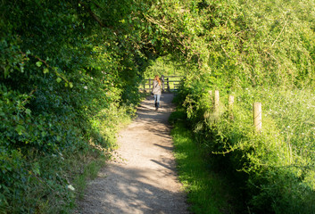 Young woman on her back walking on grantham canal,Uk.