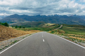 Asphalt road on mountain landscape. Travel concept