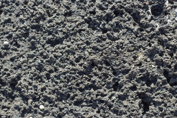 Lava volcanic texture background with dust sand sandstone shell rock small holes