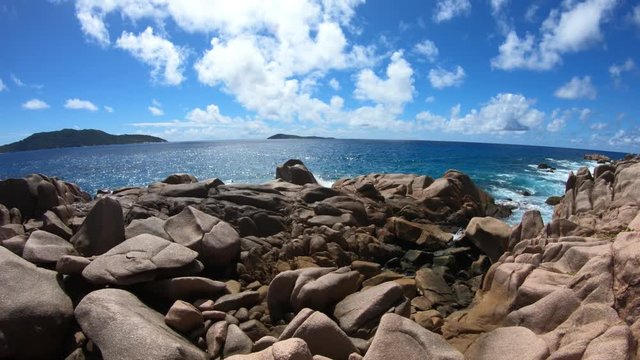 Scenic landscape of natural pool in La Digue, Seychelles. Turquoise calm waters of swimming pools at Anse Caiman remote beach between Anse Fourmis and Anse Cocos protected by huge rock formations.