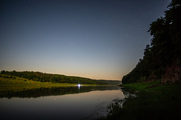 Stars on a moonlit night above the Dniester River