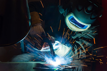 Industrial steel welder in factory welder, craftsman