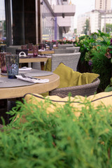 Summer terrace cafe, restaurant. Tables chairs neatly arranged and arranged to serve guests.