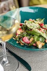 Healthy fruit platter, strawberries raspberries oranges plums apples kiwis grapes blueberries on the dark grey wooden table, top view, close up, selective focus