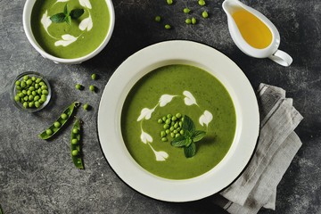 Cream of green pea soup with mint. Healthy food. Top view.