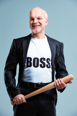 Gleeful Boss standing wielding a baseball bat