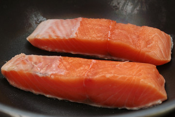 Ready raw fresh salmon for cooking in pan.