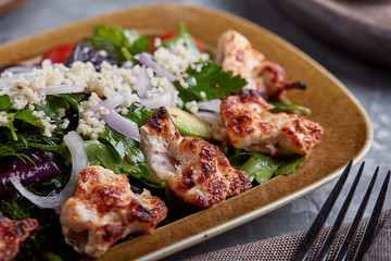 Chicken Salad. Chicken Caesar Salad. Caesar Salad with grilled chicken on plate. Grilled chicken breasts and fresh salad in plate