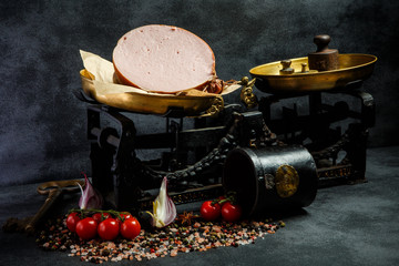 big piece of appetizing boiled sausage on craft paper