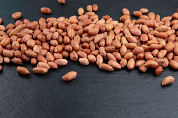 Close up of unpeeled peanuts