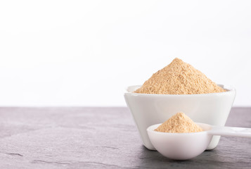 Organic maca powder - Lepidium meyenii. White background