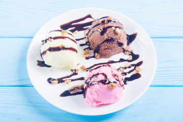 Ice cream with walnuts and chocolate topping