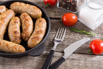 Grilled sausages with tomatoes , pepper and rosemary