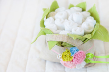 Handmade toy. flowers basket of textiles, fabrics and yarn. Flowers basket sewn by hand. Copy space
