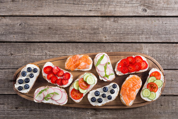 Variation of toast with fruit , vegetable and salmon