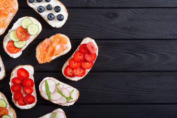 Variation of toast with fruit , vegetable and salmon