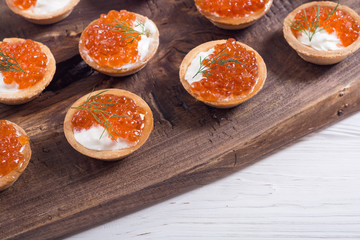 Tartalets with red caviar