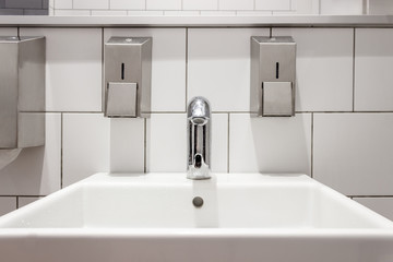 Cleaned, shiny toilet, bathroom close.