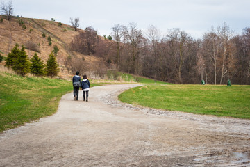 Fototapeta premium young couple walking in the park