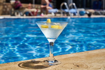 Tasty alcoholic beverage and pool view